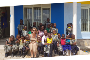 Affcad UK Charity Team with happy School children in Bwaise